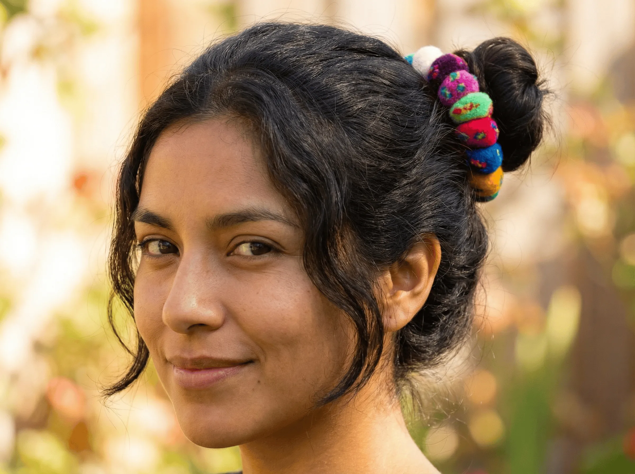 Woman wearing a colorful Peruvian scrunchie