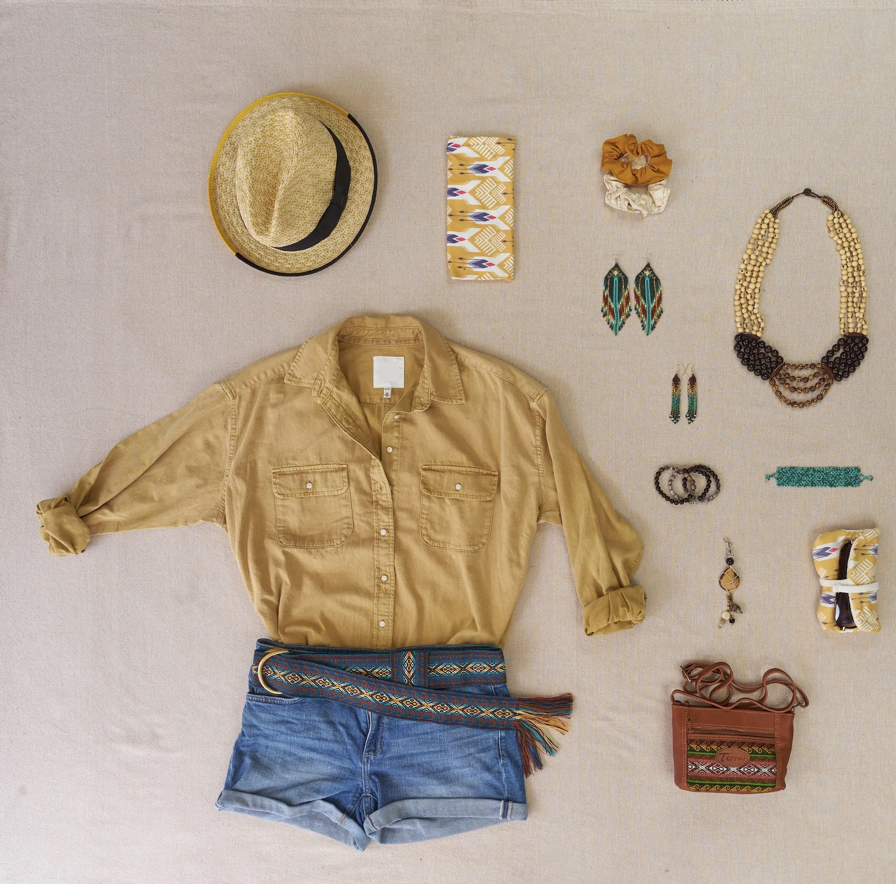 Terra handmade accessories: tagua and seed jewelry, woven belt, leather bag, scrunchies and hat